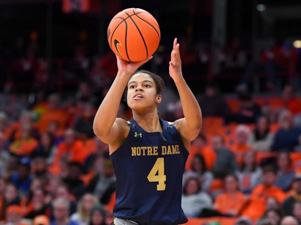 Notre Dame guard Cassandre Prosper — seen shooting a basketball during a game this past January — is among dozens of Canadians playing in March Madness this month. (Rich Barnes/USA TODAY Sports/Reuters - image credit)