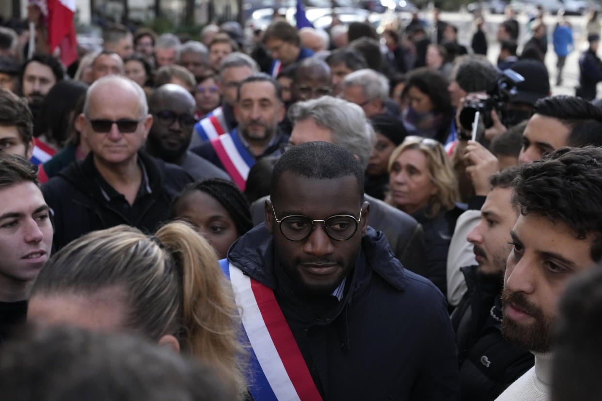 Black lawmaker Carlos Martens Bilongo arrives to a rally Friday, Nov. 4, 2022 outside the National Assembly in Paris. Carlos Martens Bilongo said Friday he was "deeply hurt" after a far-right member of the French parliament made a racist remark during a legislative session, something that has triggered condemnations from across the political spectrum. The comments shocked many, up to France's president himself, and raised new questions about xenophobia on the far right and other parts of French society. (AP Photo/Thibault Camus)