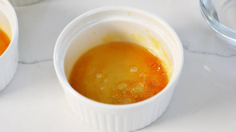 Bubbling caramel sauce in a ramekin