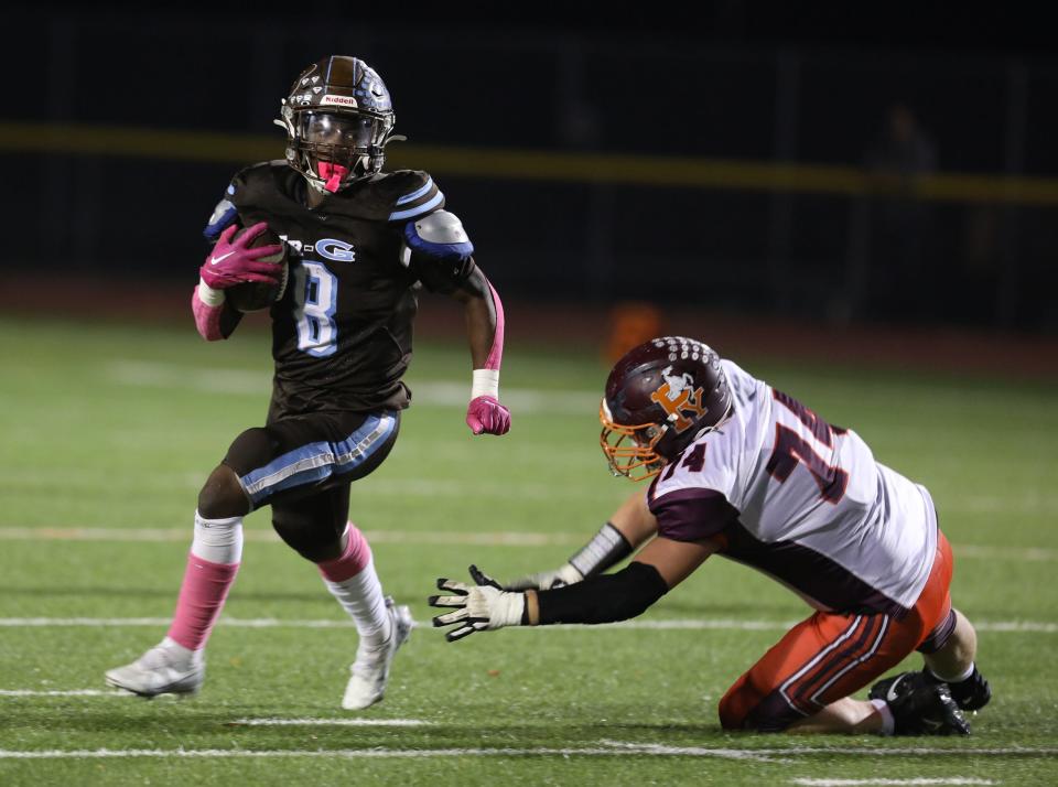 East Rochester's Cadearrell Sneed Jr. gets past Penn Yan/Dundee's Reed Bouchard during their game at East Rochester High School in East Rochester on Oct. 14, 2022.