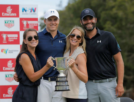 Golf - Australian Open Golf Tournament - Sydney, Australia - 20-11-2016 Jordan Spieth of the United States (2nd L) poses with the Stonehaven Cup after winning the Australian Open alongside his girlfriend Annie Verret (L), his caddie Michael Greller (R) and Greller's wife Ellie. REUTERS/Jason Reed