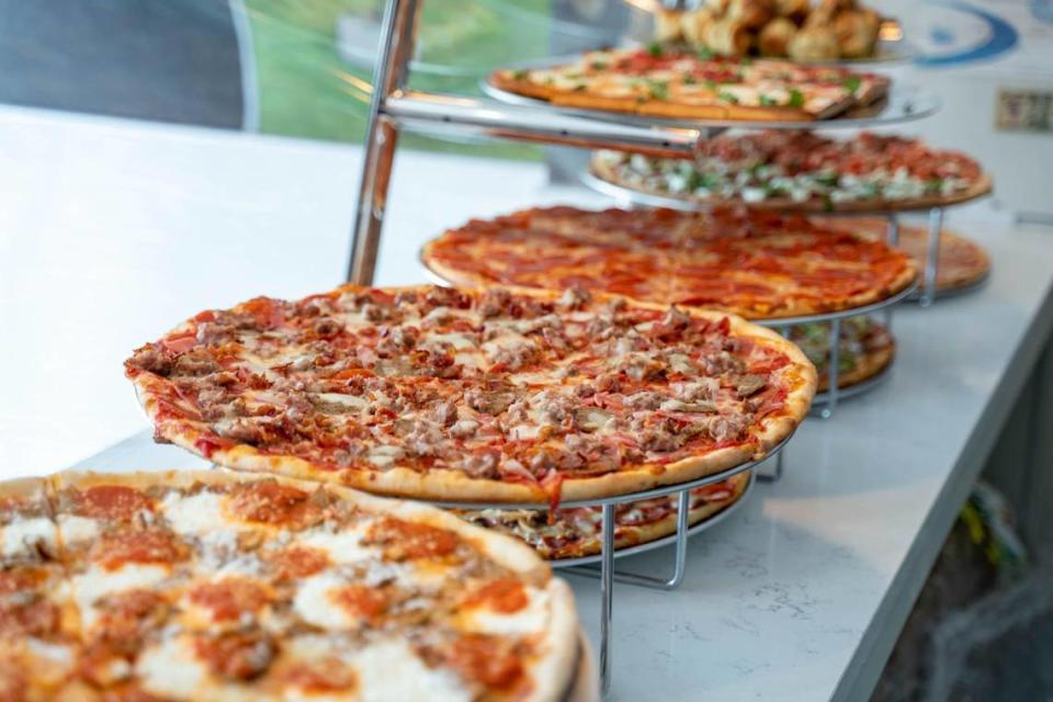 Pizzas are lined up on display at Sal’s Pizza Factory for daily lunch slices.