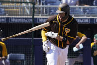 San Diego Padres' Victor Caratini tosses his bat after a walk during the first inning of the team's spring training baseball game against the Oakland Athletics, Thursday, March 18, 2021, in Peoria, Ariz. (AP Photo/Sue Ogrocki)