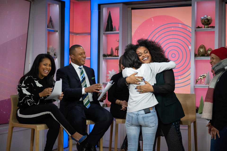 Jill Scott hugging a fan who just got free tickets to her upcoming concert. (Nathan Congleton / TODAY)