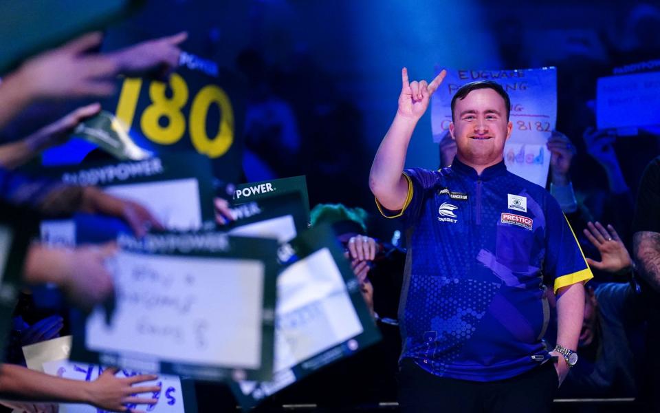 Luke Littler came out to play Andrew Gilding (not pictured) on day seven of the Paddy Power World Darts Championship at London's Alexandra Palace