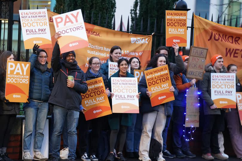 People holding orange BMA placards