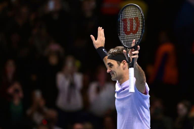 Roger Federer celebrates his three set victory over Marin Cilic in their men's singles round-robin match on day five of the ATP World Tour Finals tennis tournament at the O2 Arena in London on November 16, 2017