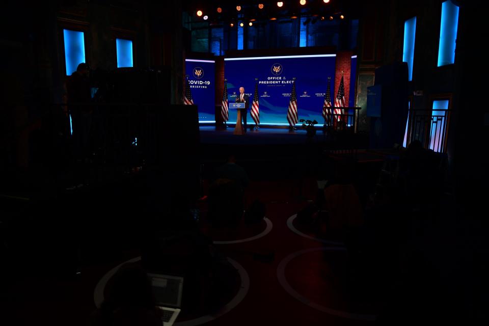 Journalists sit in socially-distanced circles in front of the stage as President-elect Joe Biden delivers remarks on the COVID-19 pandemic at The Queen on December 29, 2020 in downtown Wilmington.