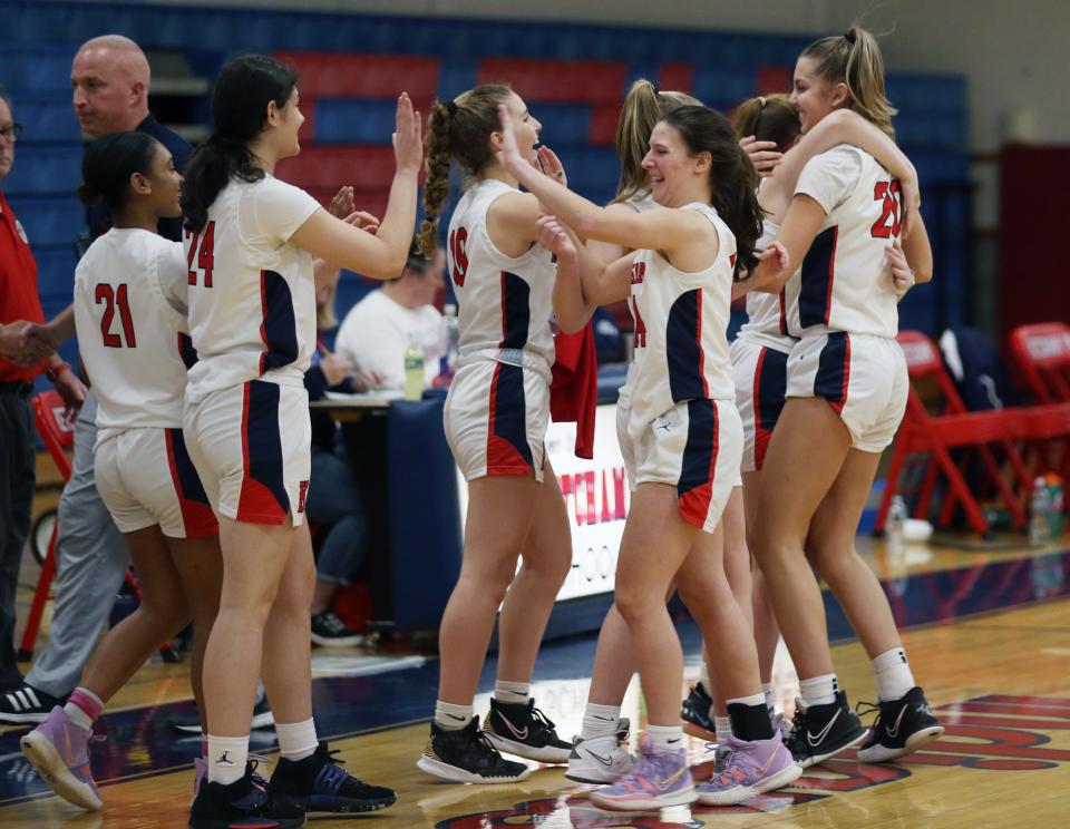 The Ketcham girls basketball team is all smiles after its victory over Ursuline on Dec. 28, 2022.