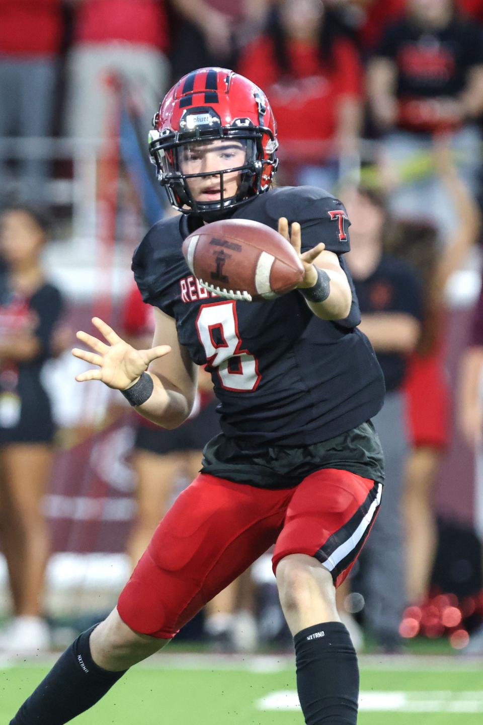 Tascosa’s Charlie McKinney (8) laterals the ball in a District 2-5A Division 1 game against Amarillo High on Friday at Bain-Schaeffer Buffalo Stadium, in Canyon.