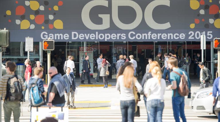 Attendees walk towards the Game Developers Conference in San Francisco, California on March 3, 2015