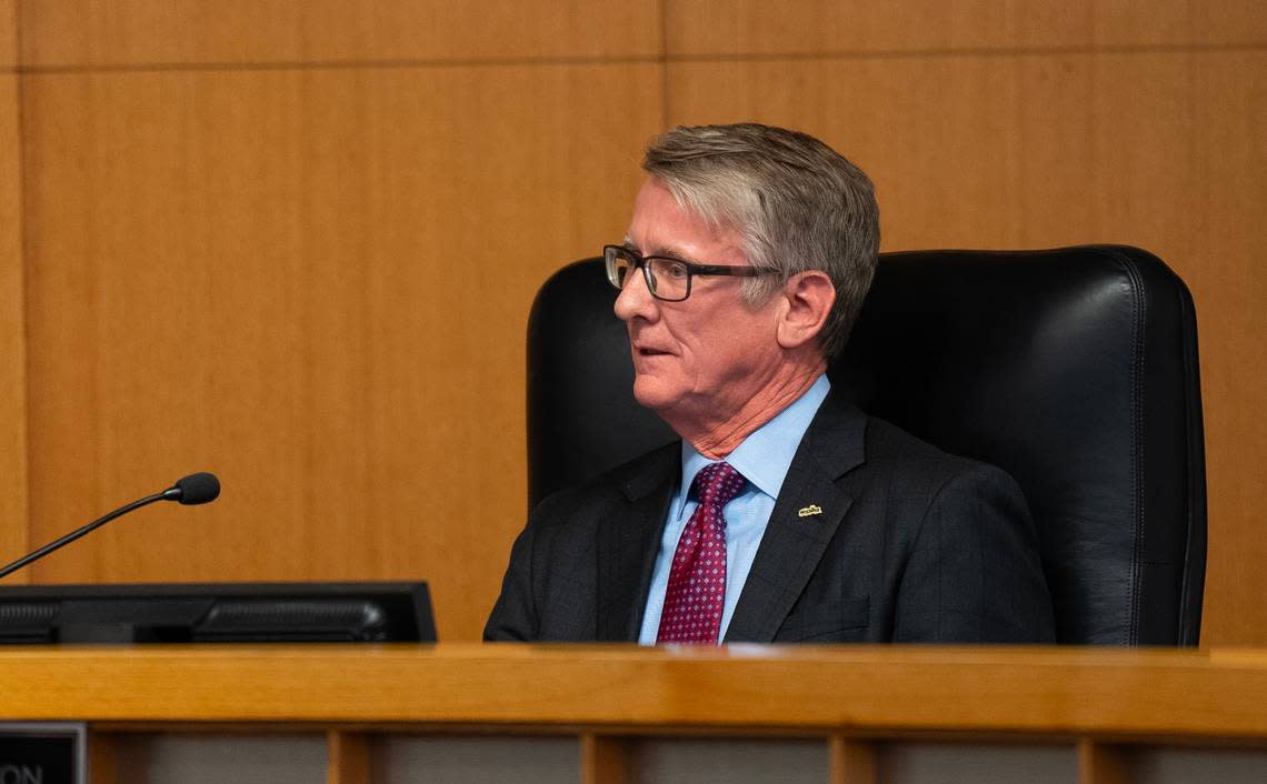 Wichita City Council member J.V. Johnston takes his seat after being sworn in on Monday evening. 