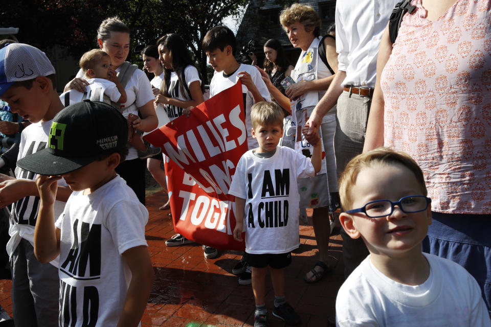 Children and their families gather to march in a protest demanding the reunification of separated immigrant families, Thursday, July 26, 2018, on Capitol Hill in Washington. The Trump administration faces a court-imposed deadline Thursday to reunite thousands of children and parents who were forcibly separated at the U.S.-Mexico border, an enormous logistical task brought on by its "zero tolerance" policy on illegal entry. (AP Photo/Jacquelyn Martin)