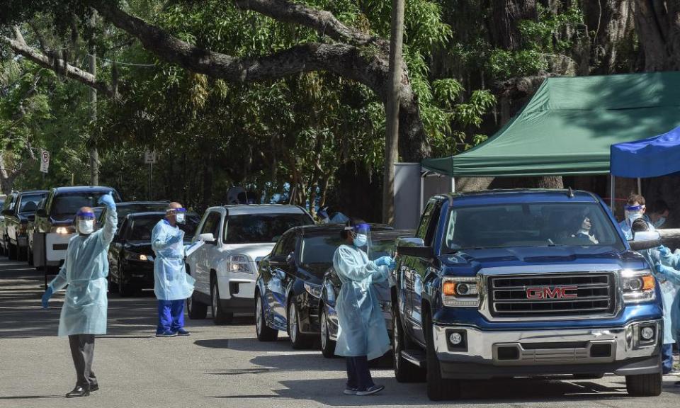 Health workers administer Covid-19 tests for people who may be unable to afford health insurance in Alatamonte Springs, Florida.