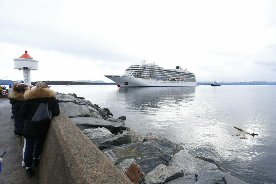 The cruise ship Viking Sky arrives at port off Molde, Norway, Sunday March 24, 2019, after having problems and issuing a Mayday call on Saturday in heavy seas off Norway's western coast. Rescue helicopters took more than 475 passengers from a cruise ship that got stranded off Norway's western coast in bad weather before the vessel departed for a nearby port under escort and with nearly 900 people still on board, the ship's owner said Sunday. (Svein Ove Ekornesvag/NTB scanpix via AP)