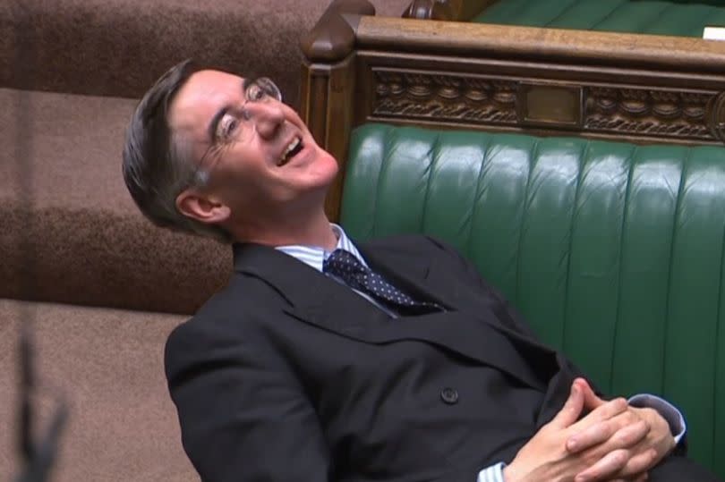 Leader of the House of Commons Jacob Rees-Mogg reclining on his seat in the House of Commons