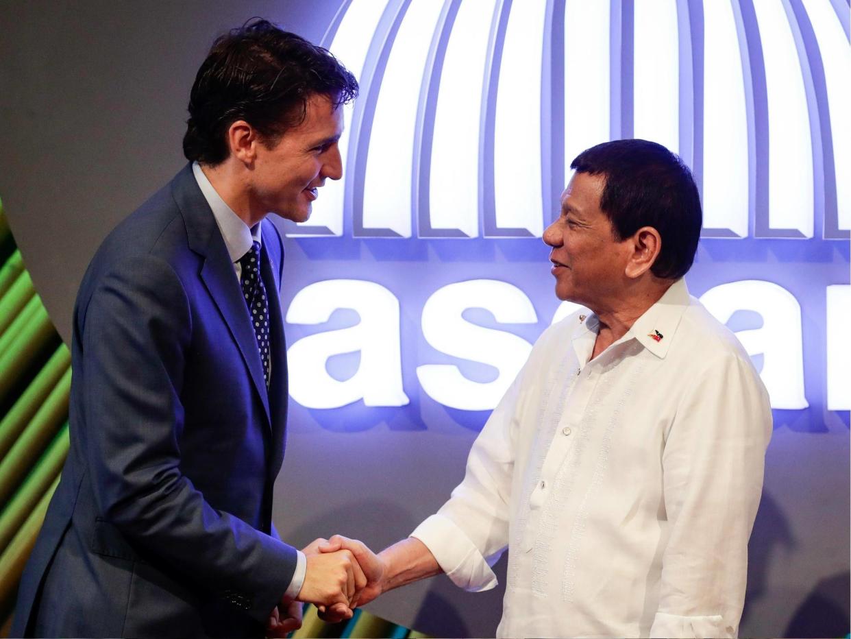 Canadian Prime Minister Justin Trudeau shakes hands with Philippine President Rodrigo Duterte at the 31st Association of Southeast Asian Nations (ASEAN) Summit in Manila on 13 November 2017: MARK R. CRISTINO/AFP/Getty Images