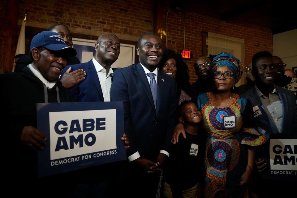 New Elected District 1 Representative, Democratic Gabe Amo stands with members of the family including his dad Gabriel Amo and 2nd to left is his mother Weady Socree on the right of the congressman. Amo is the first person of color to represent Rhode Island in Congress. Photographed on Nov 7, 2023 election night at The Guild in Pawtucket, RI.