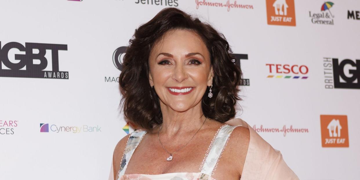shirley ballas smiles and wears a white floral dress as she attends the british lgbt awards 2023
