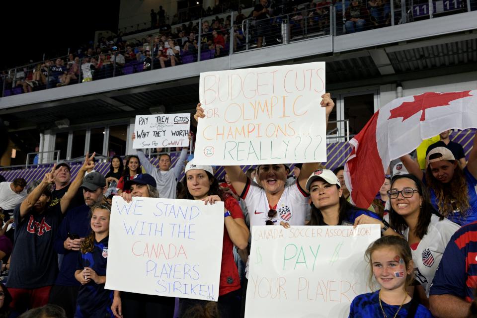 Spectators show their support for Canada's players before Canada's SheBelieves Cup game against the United States in Orlando, Florida.