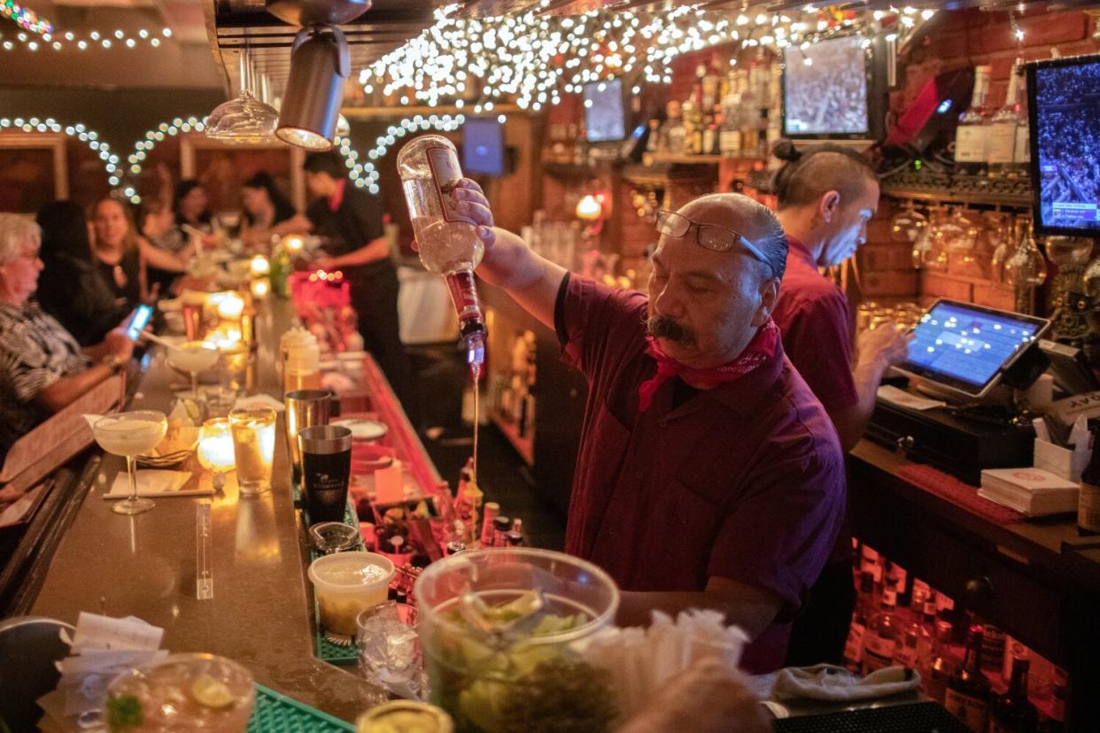 A bartender makes drinks at Casa Vega.