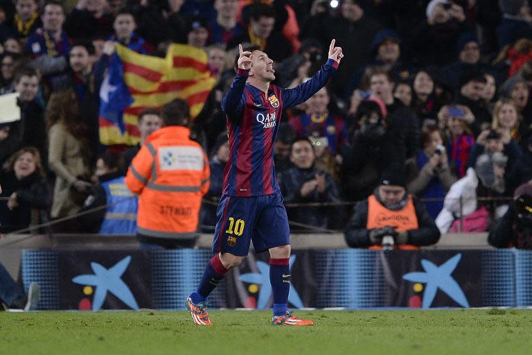 Barcelona's Argentinian forward Lionel Messi celebrates his goal during the Spanish Copa del Rey quarter final first leg football match FC Barcelona vs Club Atletico de Madrid in Barcelona on January 21, 2015
