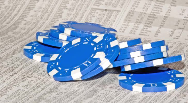 a pile of blue chips on top of a newspaper