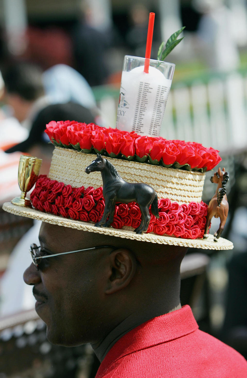 The classic mint julep glass&nbsp;sits atop a derby hat worn by a race fan in 2005.