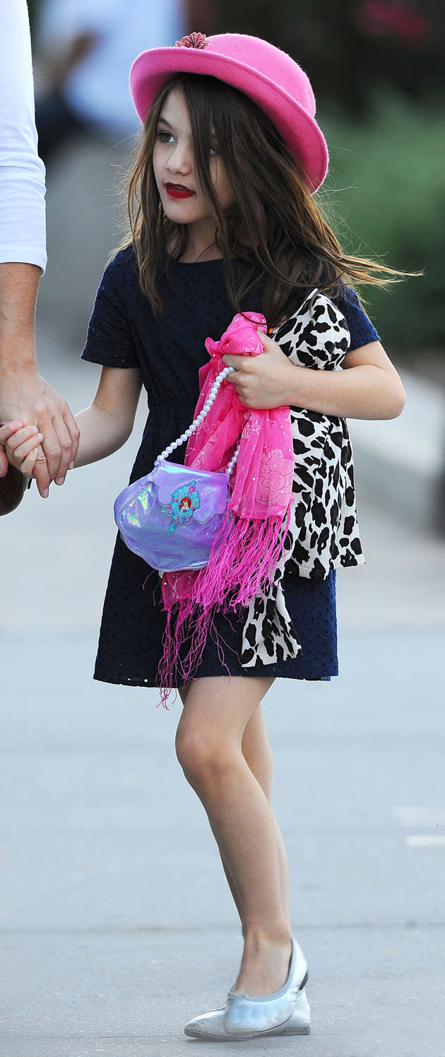 Suri Cruise stepped out in a very grown up ensemble, consisting of a bowler hat and bright pink lipstick. We can’t believe she has a better wardrobe than us.