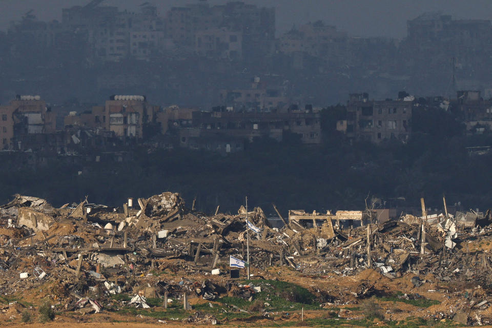 Israeli flags flutter in Gaza amid the ongoing conflict on Jan. 12.<span class="copyright">Tyrone Siu—Reuters</span>