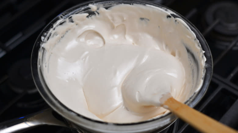 stirring nougat mixture in bowl