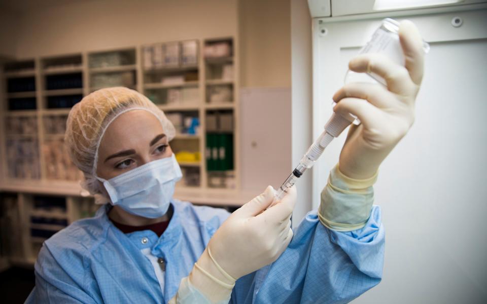 A pharmacist prepares the heroin for an addict