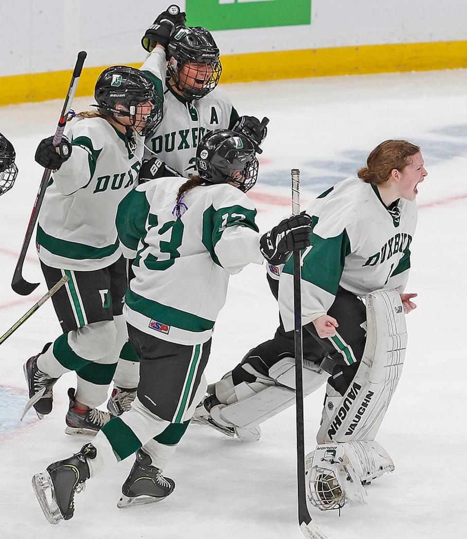 The Duxbury High girls hockey team celebrates their state championship at TD Garden on Sunday after defeating Canton.  Sunday March 19, 2023 