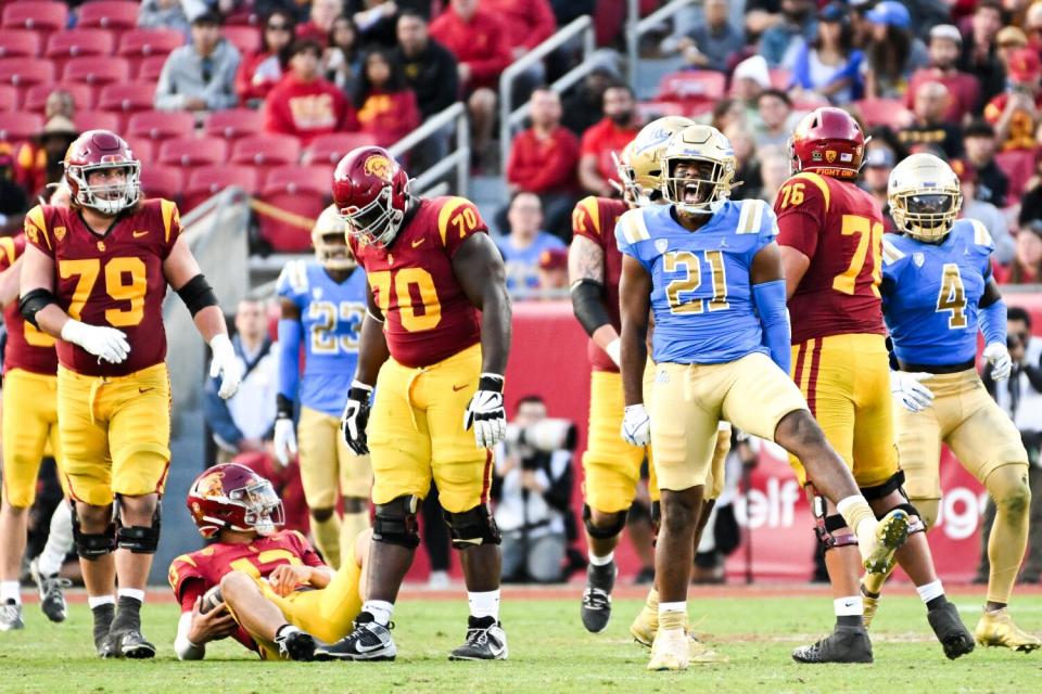 UCLA linebacker JonJon Vaughns celebrates after sacking USC quarterback Caleb Williams.