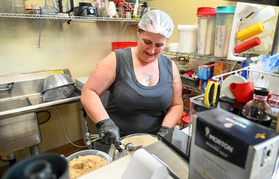Leia Perez works on homemade pretzels in the kitchen at Downtown Oak in downtown Fresno on Thursday, April 13. 2023.