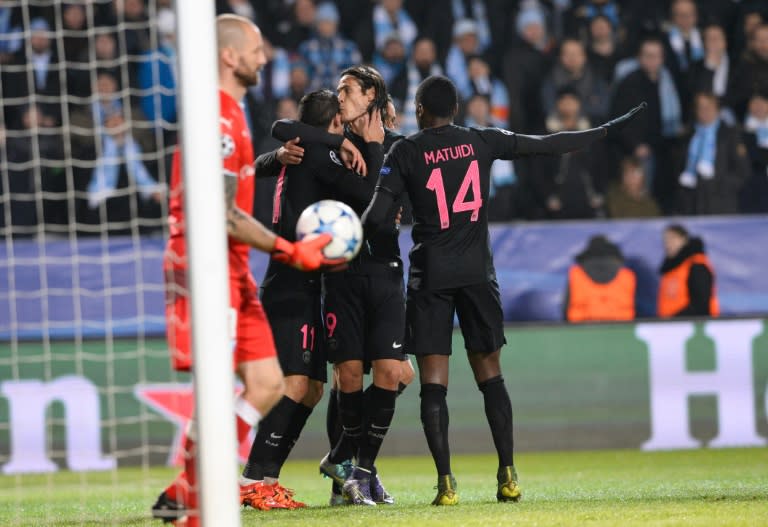 Paris Saint-Germain's forward Edinson Cavani kisses forward Angel Di Maria after he scored during a UEFA Champions League match against Malmo in Malmo, Sweden on November 25, 2015