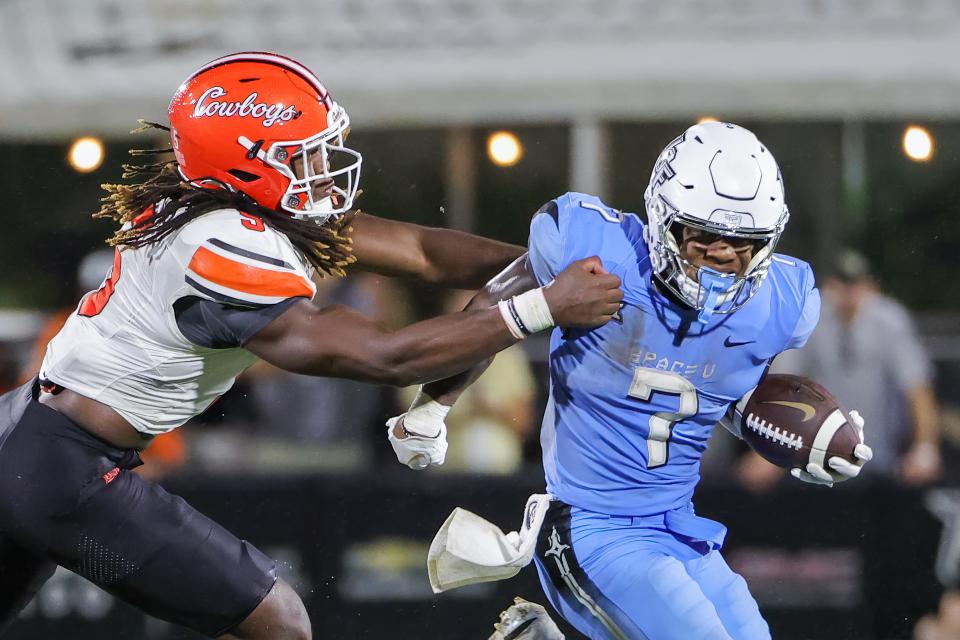 Nov 11, 2023; Orlando, Florida, USA; UCF Knights running back RJ Harvey (7) runs the ball against Oklahoma State Cowboys safety Trey Rucker (9) during the second half at FBC Mortgage Stadium. Mandatory Credit: Mike Watters-USA TODAY Sports