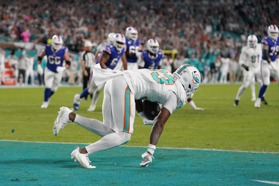 Miami Dolphins cornerback Eli Apple (33) intercepts a pass in the end zone thrown by Buffalo Bills quarterback Josh Allen during the first half of an NFL football game, Sunday, Jan. 7, 2024, in Miami Gardens, Fla. (AP Photo/Lynne Sladky)