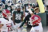 Rutgers offensive lineman Cj Hanson (50) looks towards his family after Rutgers defeated Michigan State in an NCAA college football game, Saturday, Oct. 24, 2020, in East Lansing, Mich. (AP Photo/Carlos Osorio)