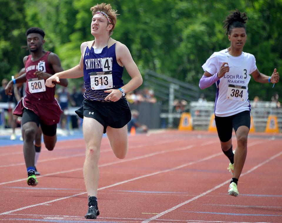 Smithsburg's Cameron Rejonis, center, crosses the finish line to win the Class 1A boys 400-meter dash during the Maryland State Track & Field Championships at the Prince George's Sports & Learning Complex in Landover, Md., Saturday.