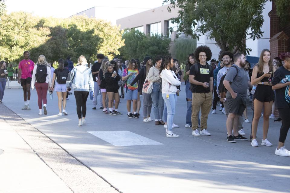 ASU students line up in front of the Sun Devil Fitness Complex in Tempe waiting to vote in the midterm election on Nov. 8, 2022.