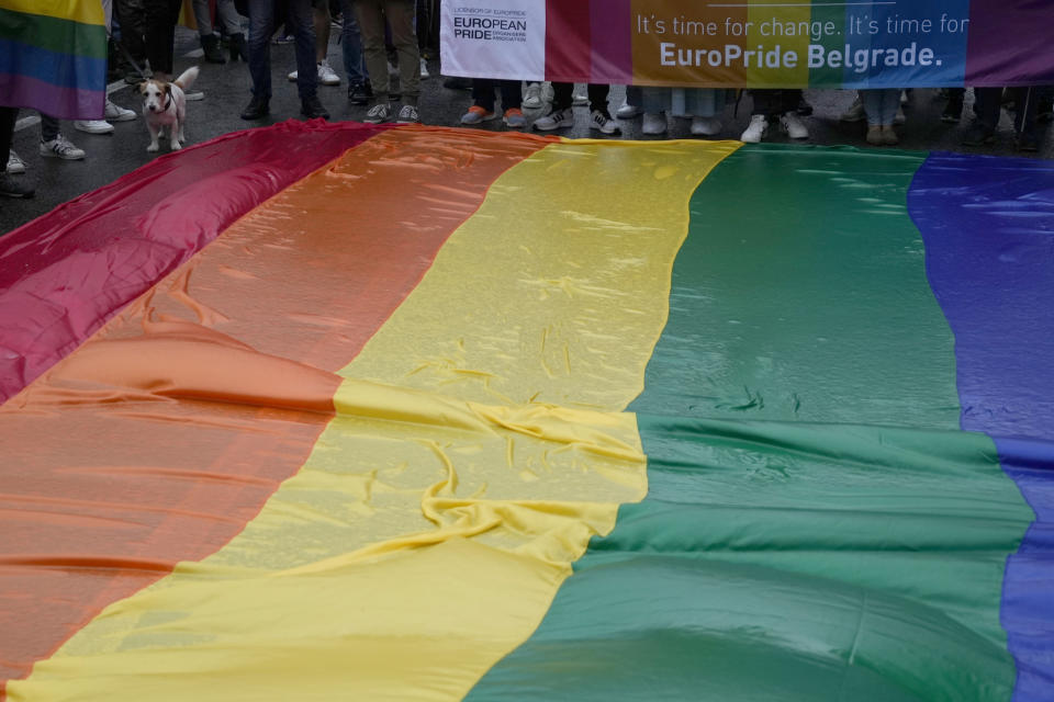 People take part in the European LGBTQ pride march in Belgrade, Serbia, Saturday, Sept. 17, 2022. Serbian police have banned Saturday's parade, citing a risk of clashes with far-right activists. (AP Photo/Darko Vojinovic)