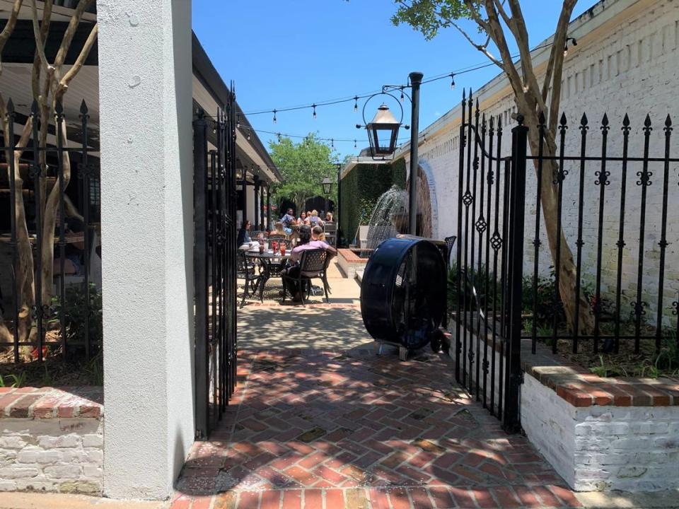 A courtyard tucked away off Washington Avenue in downtown Ocean Springs is a favorite at the new The Lady May restaurant.