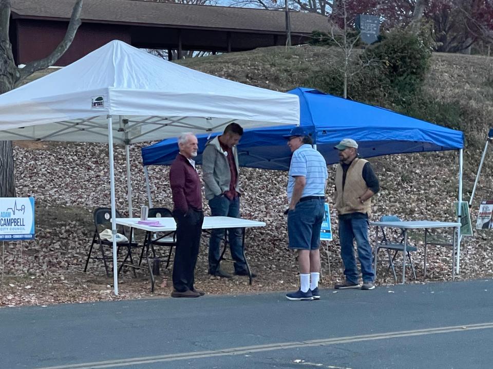 Mike (far left) and Clay (middle left) Campbell speaking to voters. Adam Campbell is running for Staunton City Council Nov. 7, 2023.