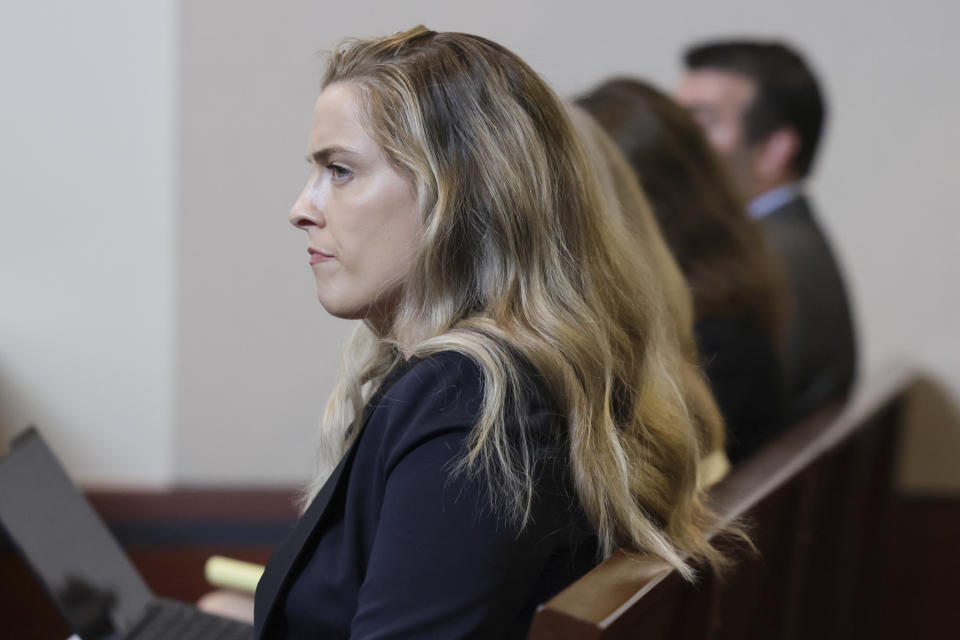 Whitney Henriquez, sister of actor Amber Heard, sits in the courtroom at the Fairfax County Circuit Courthouse in Fairfax, Va., Wednesday, May 25, 2022. Actor Johnny Depp sued his ex-wife Amber Heard for libel in Fairfax County Circuit Court after she wrote an op-ed piece in The Washington Post in 2018 referring to herself as a "public figure representing domestic abuse." (Evelyn Hockstein/Pool photo via AP)