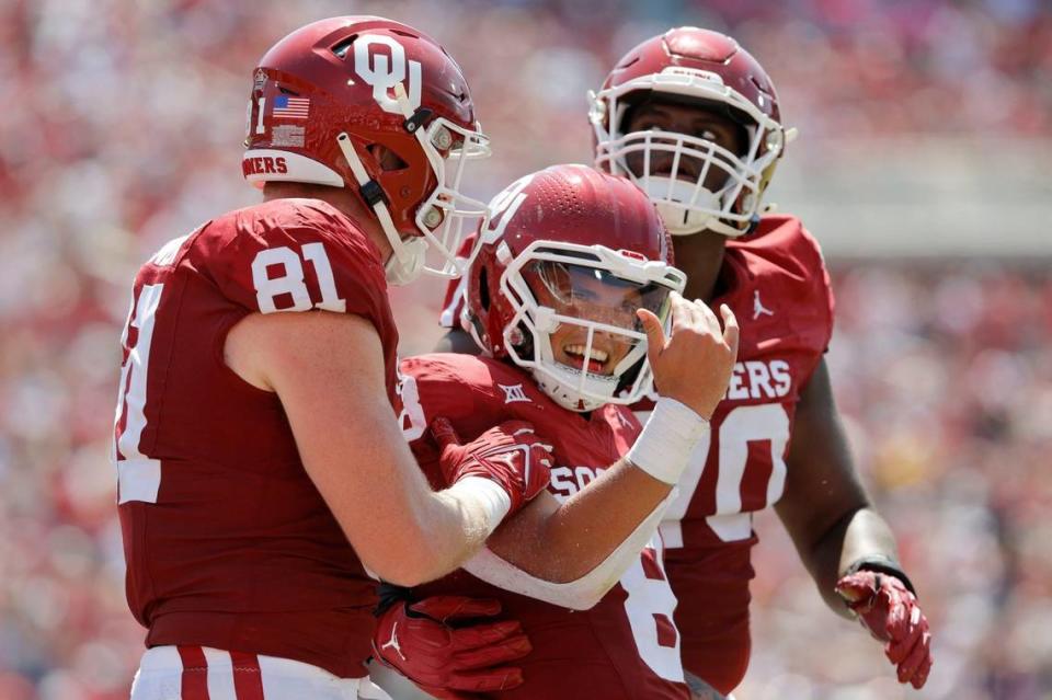 Oklahoma’s Dillon Gabriel (8) celebrates beside <span class="caas-xray-inline-tooltip"><span class="caas-xray-inline caas-xray-entity caas-xray-pill rapid-nonanchor-lt" data-entity-id="Austin_Stogner" data-ylk="cid:Austin_Stogner;pos:3;elmt:wiki;sec:pill-inline-entity;elm:pill-inline-text;itc:1;cat:Athlete;" tabindex="0" aria-haspopup="dialog"><a href="https://search.yahoo.com/search?p=Austin%20Stogner" data-i13n="cid:Austin_Stogner;pos:3;elmt:wiki;sec:pill-inline-entity;elm:pill-inline-text;itc:1;cat:Athlete;" tabindex="-1" data-ylk="slk:Austin Stogner;cid:Austin_Stogner;pos:3;elmt:wiki;sec:pill-inline-entity;elm:pill-inline-text;itc:1;cat:Athlete;" class="link ">Austin Stogner</a></span></span> (81) and Cayden Green (70) after running for a touchdown during the team’s game against Arkasnas State at Gaylord Family-Oklahoma Memorial Stadium in Norman, Okla., Saturday, Sept. 2, 2023. Bryan Terry/Bryan Terry / USA TODAY NETWORK