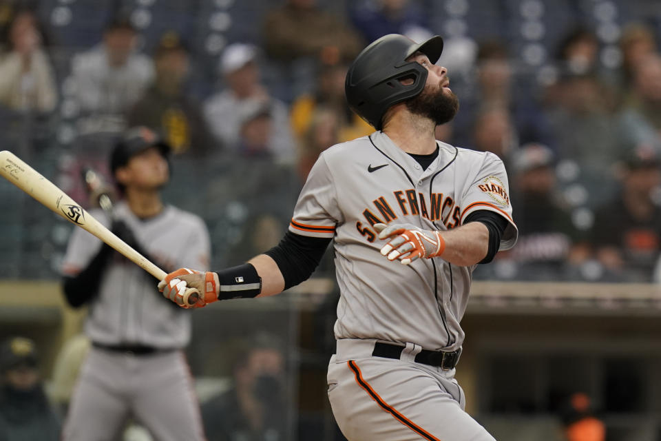 San Francisco Giants' Brandon Belt watches his single during the fourth inning of a baseball game against the San Diego Padres, Saturday, May 1, 2021, in San Diego. (AP Photo/Gregory Bull)