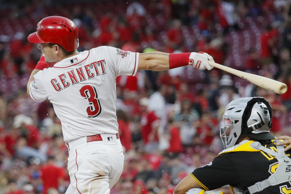 Cincinnati Reds' Scooter Gennett hits an RBI-double off Pittsburgh Pirates starting pitcher Alex McRae in the second inning of a baseball game, Monday, July 29, 2019, in Cincinnati. (AP Photo/John Minchillo)