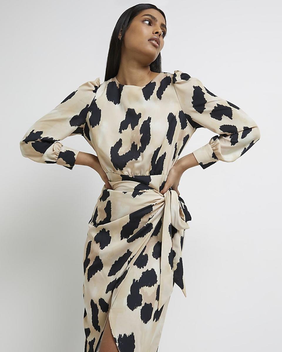 <p><a href="https://go.redirectingat.com?id=74968X1596630&url=https%3A%2F%2Fwww.riverisland.com%2Fus%2Fp%2Fbeige-leopard-print-satin-wrap-midi-dress-771196&sref=https%3A%2F%2Fwww.seventeen.com%2Ffashion%2Fceleb-fashion%2Fa44038862%2Fcharli-damelio-sheer-dress-grand-prix%2F" rel="nofollow noopener" target="_blank" data-ylk="slk:Shop Now;elm:context_link;itc:0;sec:content-canvas" class="link ">Shop Now</a></p><p>Beige leopard print satin wrap midi dress</p><p>$93.00</p><p>riverisland.com</p>