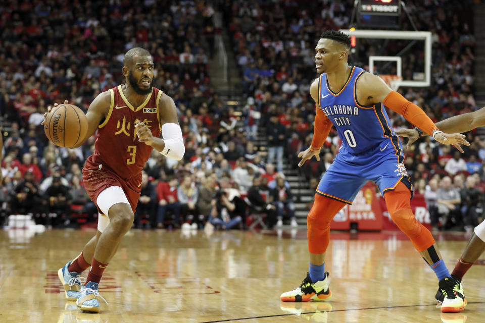 HOUSTON, TX - FEBRUARY 09:  Chris Paul #3 of the Houston Rockets drives to the basket defended by Russell Westbrook #0 of the Oklahoma City Thunder in the first half at Toyota Center on February 9, 2019 in Houston, Texas.  NOTE TO USER: User expressly acknowledges and agrees that, by downloading and or using this photograph, User is consenting to the terms and conditions of the Getty Images License Agreement.  (Photo by Tim Warner/Getty Images)